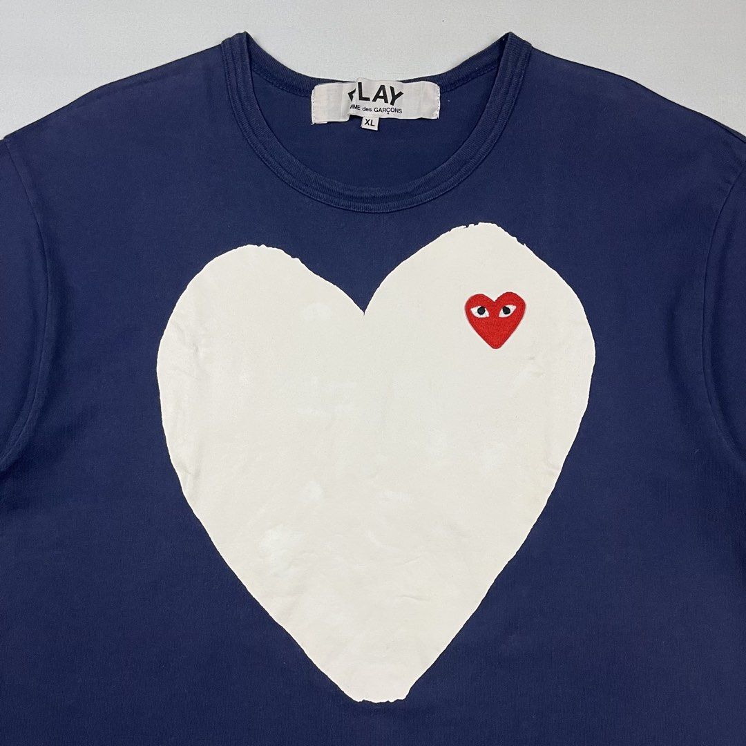 Comme des Garçons x Play Solid Heart Logo Tee (Category: Tshirts & Polo Shirts ) located in Puerto Princesa. Submitted by paradise5300 (Listing ID 1460883740, Image 3). Description: Comme des Garçons x Play Solid Heart Logo Tee Tagged Size: XL Dimensions inches length: 29 inches width: 20 Condition: Excellent Color rate: 9.5 Flaws: None 1,499 shipping fee is not yet included. .