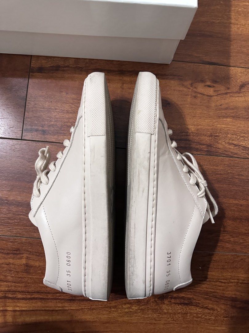 Common Projects Woman Achilles Low Sneakers (Category: Sneakers) located in Quezon City. Submitted by kris_16171 (Listing ID 1460742491, Image 2). Description: - Authentic Common Projects Achilles Low sneakers - Made in Italy - Premium leather upper - Durable rubber sole - Comes with original box - Includes extra laces and dust bag - has some creasing on the inside No longer fits after pregnancy Nude colour size 35.