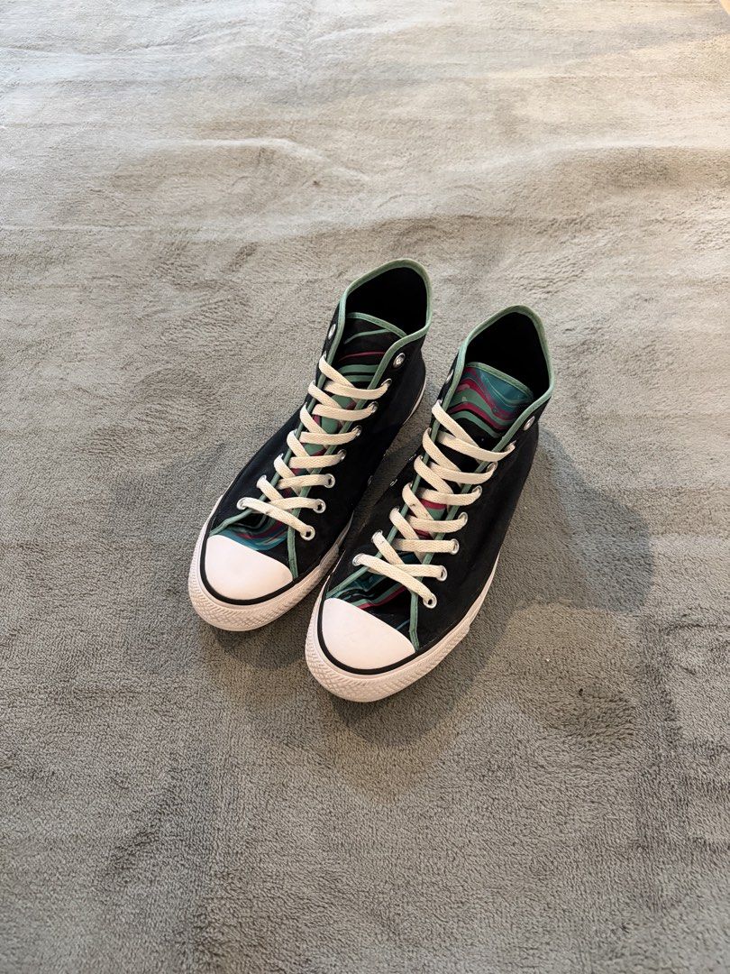 Converse All Star High Top Sneakers Black Teal Pattern (Category: Sneakers) located in Caloocan City. Submitted by maempenafi21452 (Listing ID 1460722360, Image 2). Description: - Classic Converse Chuck Taylor high-tops - Black with a cool teal and pink pattern on the heel and inner lining - Lace-up closure - White rubber toe cap and sole - Perfect for everyday wear - Selling as they are no longer needed.