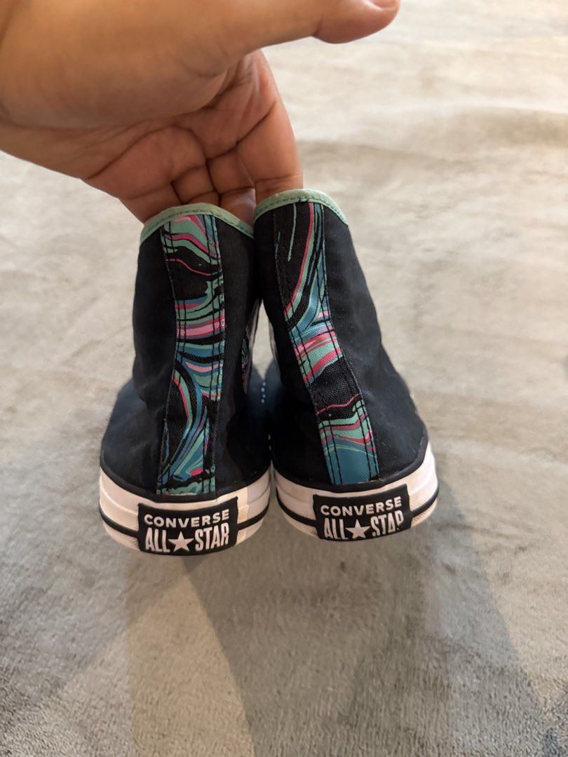 Converse All Star High Top Sneakers Black Teal Pattern (Category: Sneakers) located in Caloocan City. Submitted by maempenafi21452 (Listing ID 1460722360, Image 3). Description: - Classic Converse Chuck Taylor high-tops - Black with a cool teal and pink pattern on the heel and inner lining - Lace-up closure - White rubber toe cap and sole - Perfect for everyday wear - Selling as they are no longer needed.