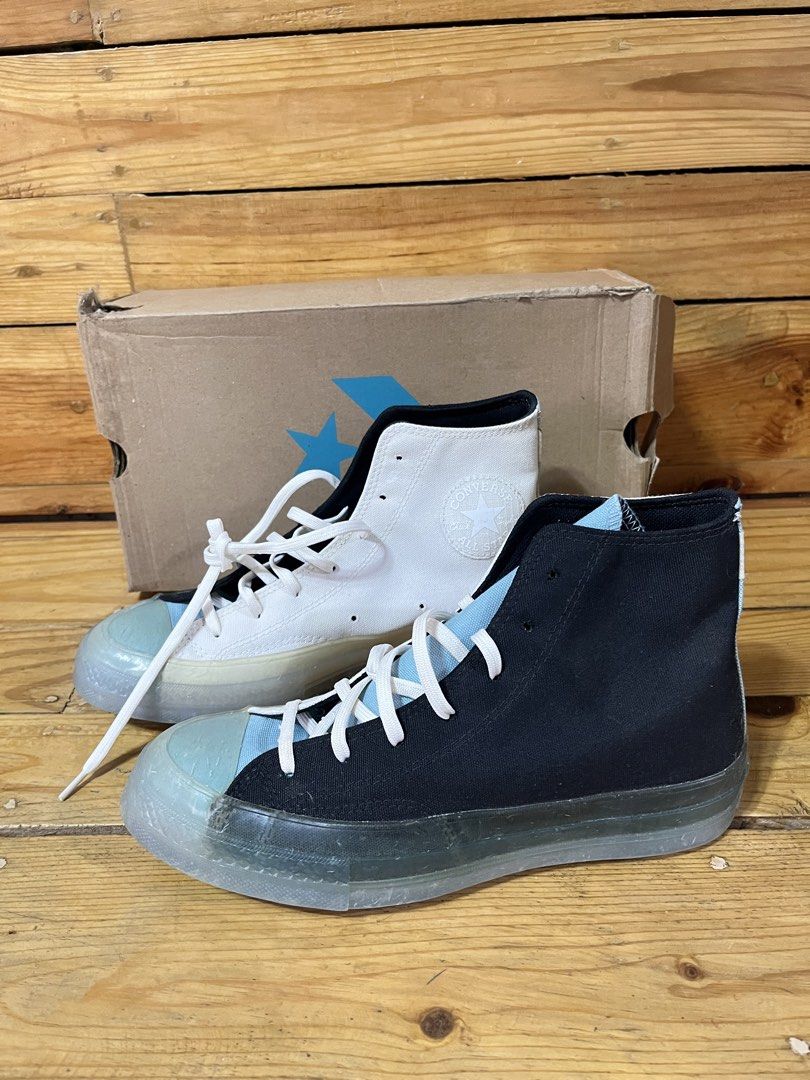 Converse Chuck 70 High Top Sneakers (Category: Sneakers) located in Manila. Submitted by samuelsabiduria (Listing ID 1460735427, Image 1). Description: Selling a pair of Converse Chuck 70 high tops. One shoe is white, the other is black. Both have translucent icy soles with a light blue accent on the toe cap. Comes with the original box. Great for casual wear..
