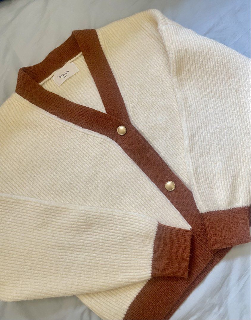 Cream & Brown Knit Cardigan (Category: Coats, Jackets and Outerwear) located in Cavite. Submitted by ynahmo (Listing ID 1460789663, Image 2). Description: - Cream knit cardigan - Brown trim details - Gold front buttons - Ideal for layering - Paired best with shorts or high waisted pants - Size: Medium to Semi-large - Inner & shorts not included.