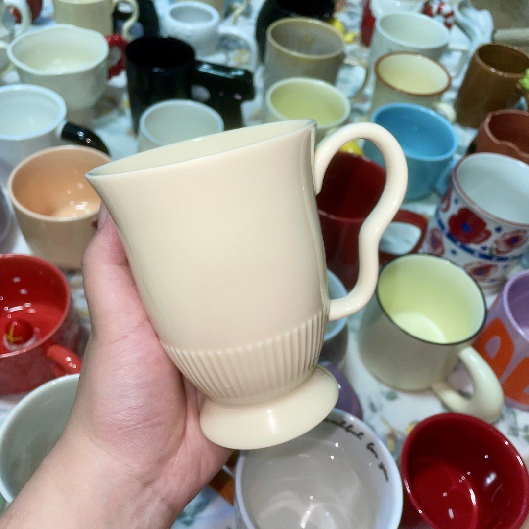 Cream Ceramic Mug with Ribbed Base (Category: Coffee & Tea Tableware) located in Valenzuela. Submitted by baekhyunie_pau (Listing ID 1460799947, Image 1). Description: Cream colored mug with ribbed texture and curved handle. Perfect for coffee or tea, everyday use, or gifting. (3 pieces available).