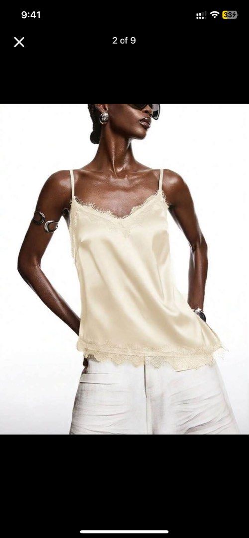 Cream Lace Trim Satin Cami Top (Category: Sleeveless) located in Valenzuela. Submitted by grasyahh (Listing ID 1460866342, Image 2). Description: - Cream satin cami top - Delicate lace trim - Adjustable spaghetti straps - Flattering asymmetrical hemline - Super soft and silky material - Perfect for layering or wearing solo - Dress up or down for any occasion.