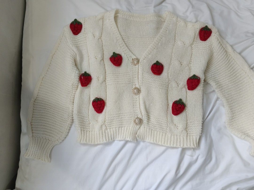 Cream Strawberry Knit Cardigan (Category: Coats, Jackets and Outerwear) located in San Juan City. Submitted by chanellycloe (Listing ID 1460773500, Image 1). Description: Brand: N/A Color: Cream Style: Cardigan Price: 150 📏Measurements: - Size (M-L) Mode of Payment: 💙GCash Mode of Delivery: 🧡Lalamove.