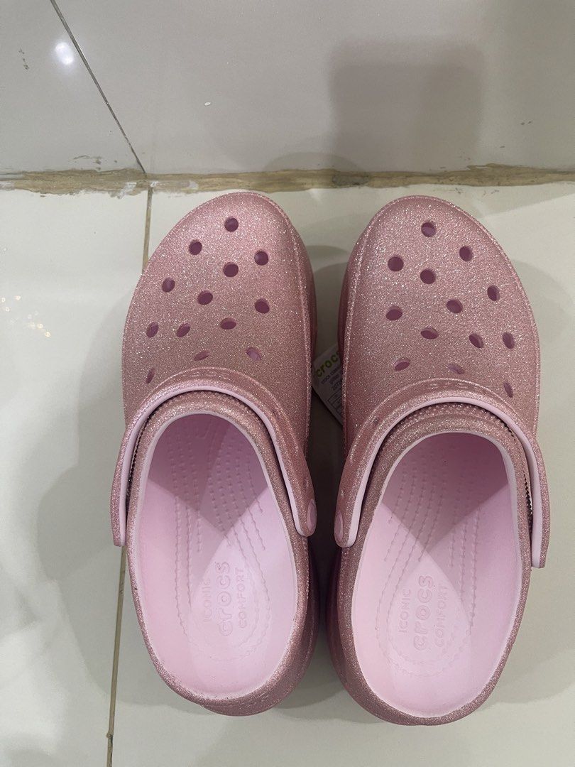 Crocs Pink Glittery high (Category: Slippers and slides) located in Quezon City. Submitted by karma_para_sa_bogus (Listing ID 1460824925, Image 1). Description: original. galing store. 2,999php lang. rare size na malaki eto.. unique colorway. Mens9, Womens11 sizing. .