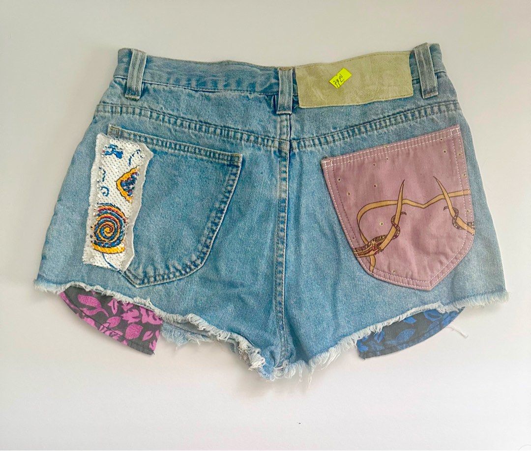 Custom Patchwork Denim Shorts Size 28W/11L (Category: Shorts) located in Antipolo. Submitted by mutyafinds (Listing ID 1460753213, Image 2). Description: - Unique custom denim shorts - Features assorted patches with diverse patterns and textures - Frayed hem detail - Perfect for a standout, one-of-a-kind look “This is preloved, so please manage your expectations.” .