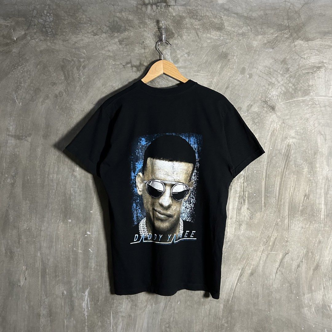 Daddy Yankee - Legendaddy Black Tee (Category: Tshirts & Polo Shirts ) located in Tayabas. Submitted by streetdepartment (Listing ID 1460903412, Image 1). Description: Daddy Yankee - Legendaddy Black Tee Measurements (inches): Width: 20” Length: 28” Tagged as Large fits M-L Excellent condition Flaw/s: minimal hairlines & lints.