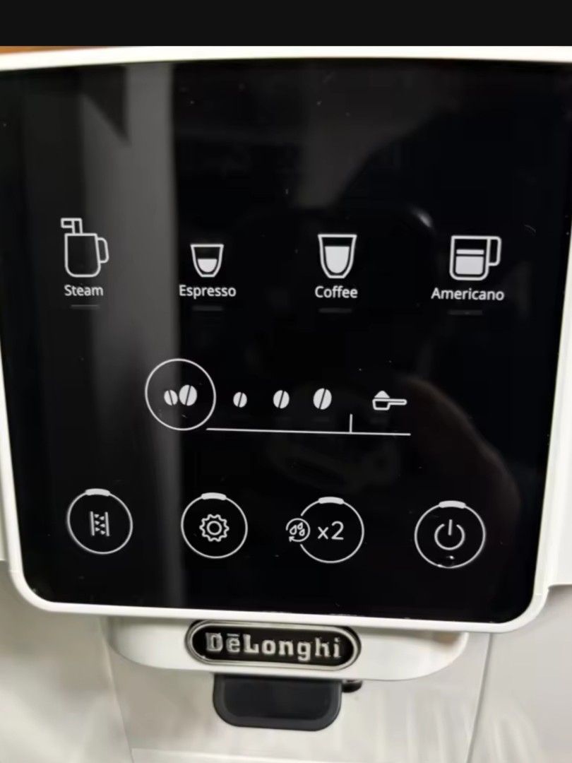 DeLonghi Magnifica Start Automatic Coffee Machine White (Category: Coffee Machines & Makers) located in Cainta. Submitted by rj.serrano (Listing ID 1460897400, Image 2). Description: White DeLonghi Magnifica Start coffee machine. Makes espresso, coffee, and americano. Has a steam wand for milk. Easy to use touch screen. Makes great coffee at home. Built-in Grinder: Integrated conical steel burr grinder with adjustable settings. One-Touch Recipes: