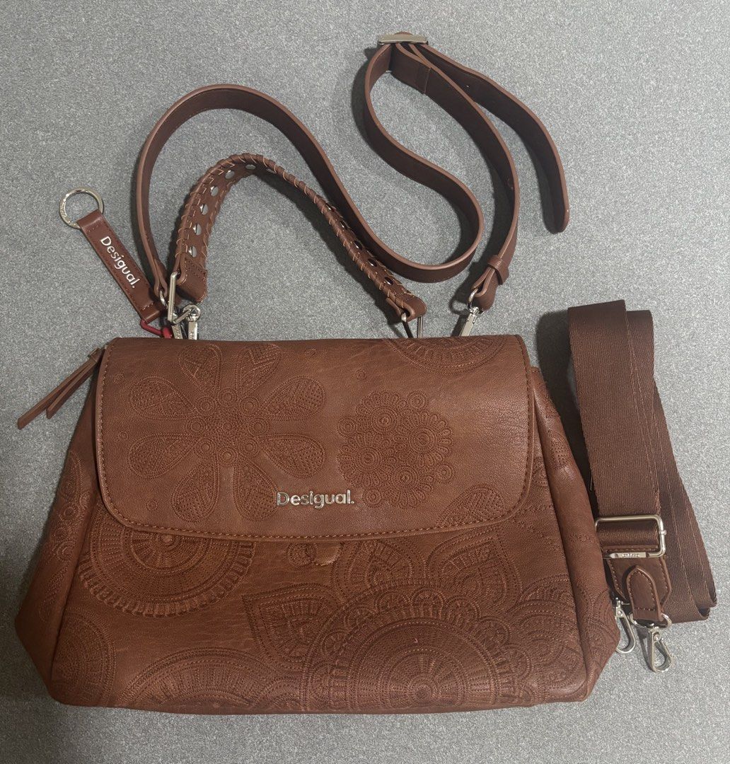 Desigual Brown Embossed Handbag with Shoulder Strap (Category: Shoulder Bags) located in San Pedro. Submitted by khaioh (Listing ID 1460747745, Image 2). Description: 🤎 DESIGUAL | BROWN EMBOSSED FLORAL BAG |ORIGINAL • Top handle + detachable shoulder strap • Comes with an extra strap • Stylish & easy to pair 💰 ₱4,000 — negotiable for sure buyers 📩 PM for details & photos..