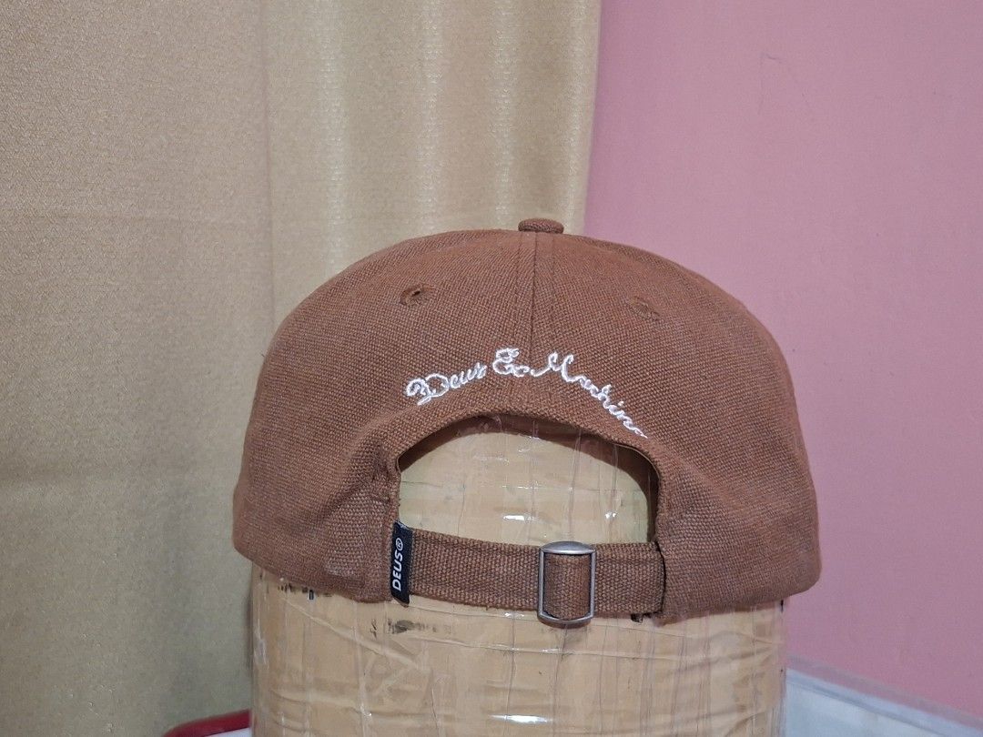 Deus Ex Machina Board & Cycle Cap Brown (Category: Caps & Hats) located in Cagayan de Oro. Submitted by ohh-kay (Listing ID 1460769051, Image 2). Description: - Brand: Deus Ex Machina - Features iconic 'Deus Ex Machina Board & Cycle' logo on the front - Deus branding also present on the back and inside the cap - Adjustable strap for a customized fit - Perfect for everyday casual wear - Prelove both this brand new 1 year ago.