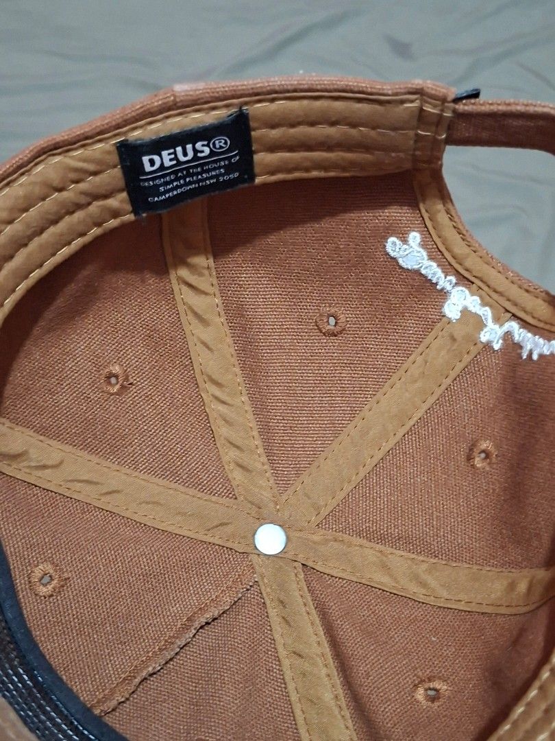 Deus Ex Machina Board & Cycle Cap Brown (Category: Caps & Hats) located in Cagayan de Oro. Submitted by ohh-kay (Listing ID 1460769051, Image 3). Description: - Brand: Deus Ex Machina - Features iconic 'Deus Ex Machina Board & Cycle' logo on the front - Deus branding also present on the back and inside the cap - Adjustable strap for a customized fit - Perfect for everyday casual wear - Prelove both this brand new 1 year ago.