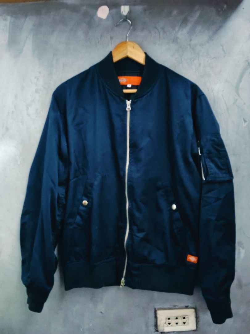 Dickies Bomber Jacket Navy Blue Size M (Category: Coats, Jackets and Outerwear) located in Caloocan City. Submitted by arielagost83627 (Listing ID 1460796657, Image 2). Description: - Navy blue Dickies bomber jacket - Size: Medium (M) - Classic zip-up front - Convenient pockets - Signature Dickies logo prominently displayed on the back - Ideal for casual everyday wear Color Rate: 9.8/10 Dimes: 24x26 Issue: See Last Pic Excellent Condition.