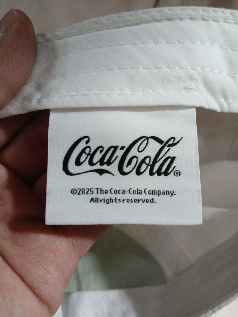 Diet Coke Cap (Category: Caps & Hats) located in La Trinidad. Submitted by dashopperist (Listing ID 1460775357, Image 3). Description: - White baseball cap - Red embroidered 'Diet Coke' logo on front - Adjustable strap with metal buckle at the back - Brand: Mad Engine - Ideal for Coca-Cola enthusiasts.