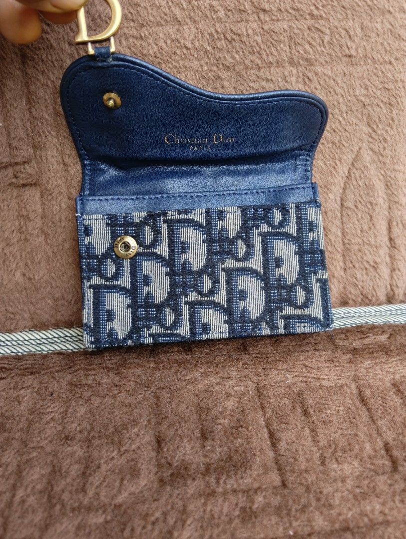 DIOR SADDLE CARD HOLDER (Category: Wallets & Card holders) located in Cagayan de Oro. Submitted by warmbird-f84aab (Listing ID 1460720289, Image 2). Description: • Brand: Christian Dior • Style: Saddle Flap Compact Card Holder • Color: Navy Blue Oblique Jacquard • Code: 43-MA-0173 • Material: Dior Oblique jacquard / Navy smooth calfskin • Serial / Date code: 43-MA-0173 • Includes: Item only 📝 Condition: Pre-loved / Good used condition - Minor ed