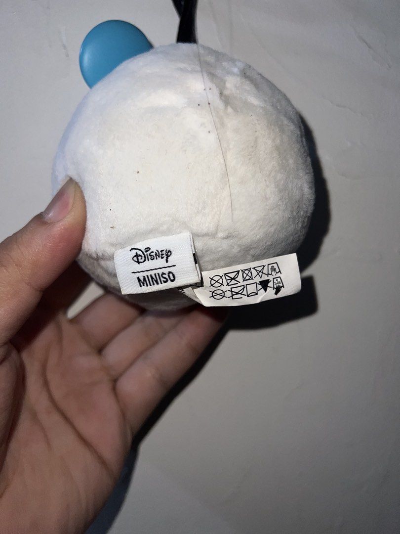 Disney Miniso Mickey Mouse Plush Keychain (Category: Plushies & Soft Toys) located in Manila. Submitted by asa68984 (Listing ID 1460872469, Image 2). Description: - Adorable white fluffy Mickey Mouse plush keychain. - Features Mickey's iconic face peeking out. - Cute blue ear detail. - Includes a black Mickey-shaped tag. - Perfect accessory for bags, backpacks, or keys. - Officially licensed Disney product, made in collaboration with Miniso..