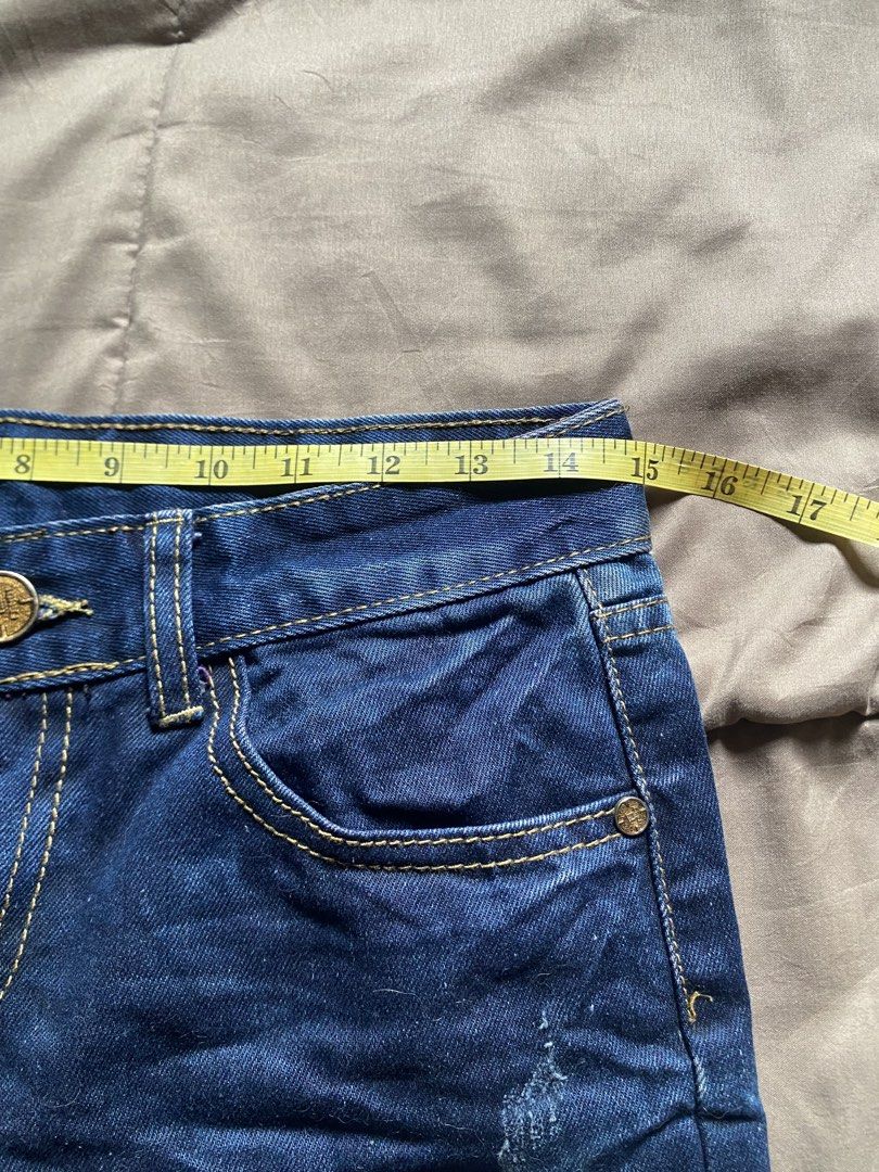 Distressed Denim Mini Skirt with Studs (Category: Skirts) located in Caloocan City. Submitted by lienzonius (Listing ID 1460727467, Image 3). Description: - Dark wash denim mini skirt - Distressed details with purple accents - Stud embellishments - Classic five-pocket styling - Button and zip closure - Approx. 14 inches length - Approx. 28 inches waist - Perfect for an edgy, casual look.