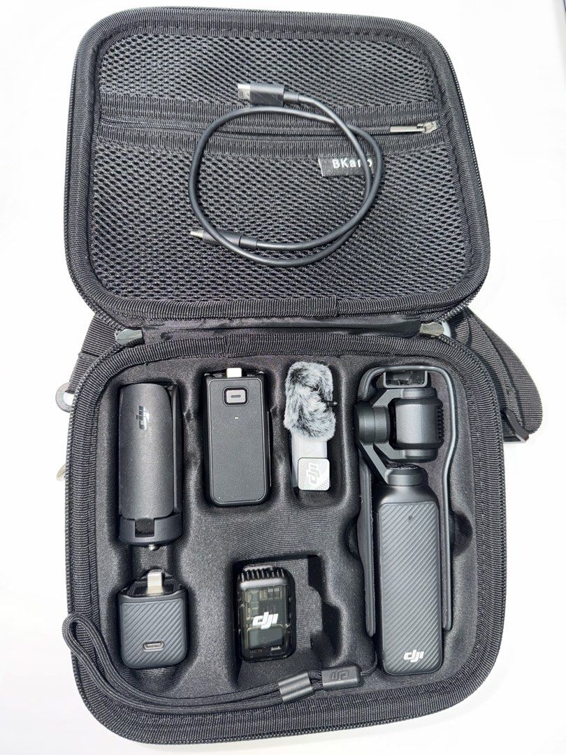 DJI Osmo Pocket 3: Creator Combo (Category: Video Cameras) located in Bocaue. Submitted by z4riy4h (Listing ID 1460716651, Image 2). Description: - Lightly used - With slight dent - Complete with Box This Creator Combo package includes: * DJI Osmo Pocket 3 Camera * Osmo Pocket 3 Battery Handle * DJI Mic 2 Transmitter * DJI Mic 2 Windscreen * DJI Mic 2 Clip Magnet * Wide-Angle Lens * Osmo Mini Tripod with 1/4” -20 thread base * Osmo Pocket 3 Carry