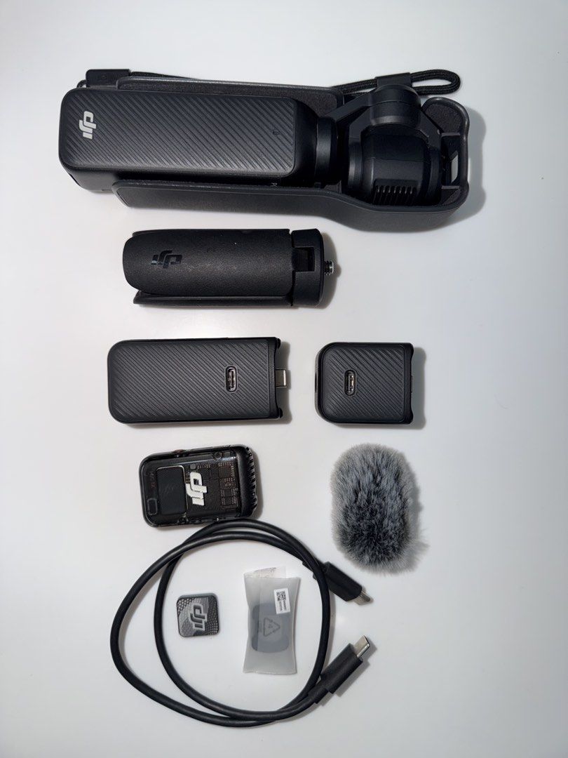 DJI Osmo Pocket 3: Creator Combo (Category: Video Cameras) located in Bocaue. Submitted by z4riy4h (Listing ID 1460716651, Image 1). Description: - Lightly used - With slight dent - Complete with Box This Creator Combo package includes: * DJI Osmo Pocket 3 Camera * Osmo Pocket 3 Battery Handle * DJI Mic 2 Transmitter * DJI Mic 2 Windscreen * DJI Mic 2 Clip Magnet * Wide-Angle Lens * Osmo Mini Tripod with 1/4” -20 thread base * Osmo Pocket 3 Carry