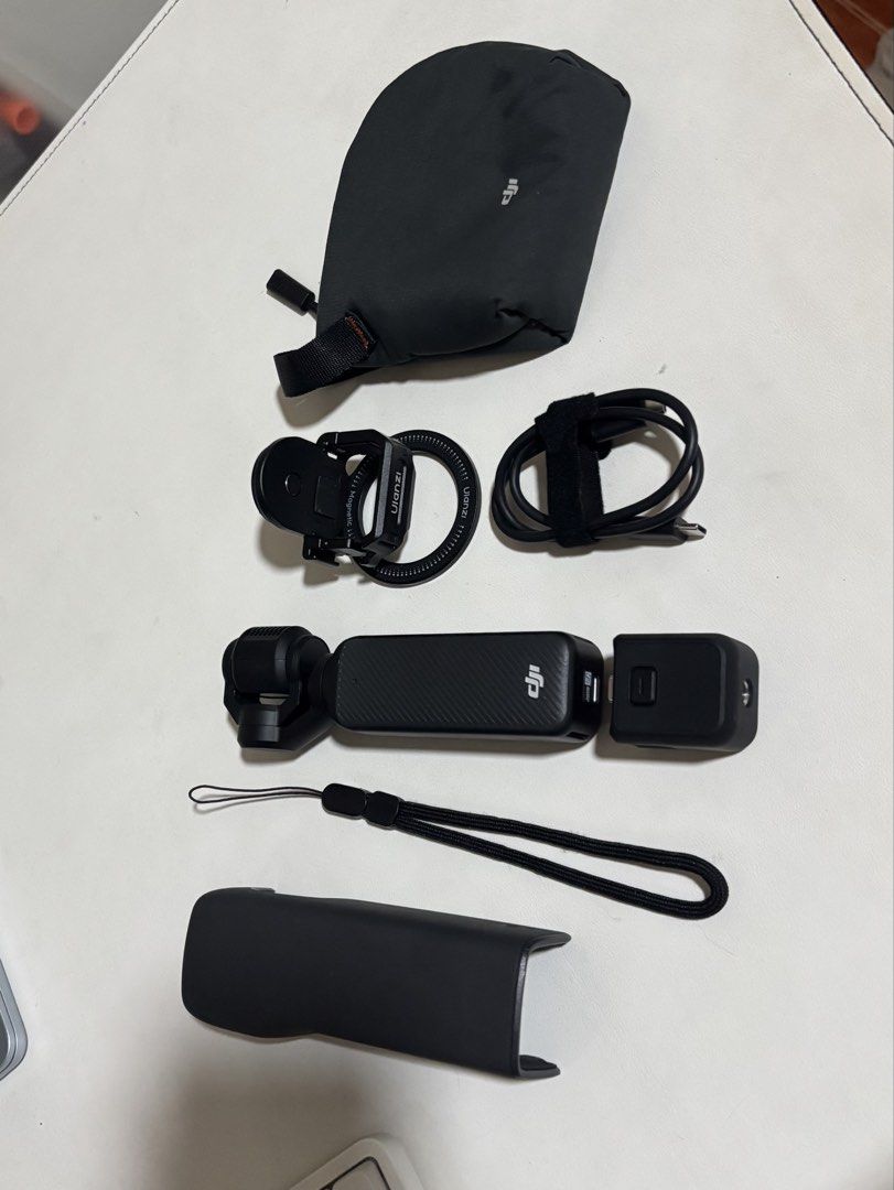 DJI Pocket 3 (Standard Combo) - no box (Category: Video Cameras) located in Manila. Submitted by luckypluto (Listing ID 1460904197, Image 1). Description: No issues, just no box, but adding in as freebies the Ulanzi Magnetic holder + DJI pouch (got it with the mic). Photos are actual. Bought Jun 2026 on official blue app store. RFS: i prefer the Action series and will re-buy. Open to swap with Action 4 only. Tbh, this was only used like - 4x. Ple