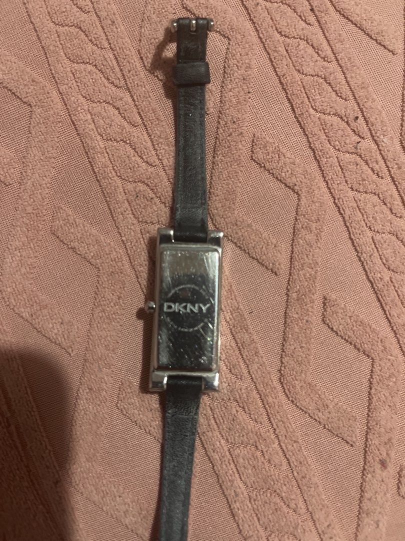 DKNY Rectangular Watch with Black Leather Strap (Category: Women's Watches) located in Cabanatuan. Submitted by carou99645 (Listing ID 1460858575, Image 2). Description: - DKNY watch - Rectangular black face - Silver-tone casing - Black leather strap - Minor scratches on back casing - Still a nice piece to wear.