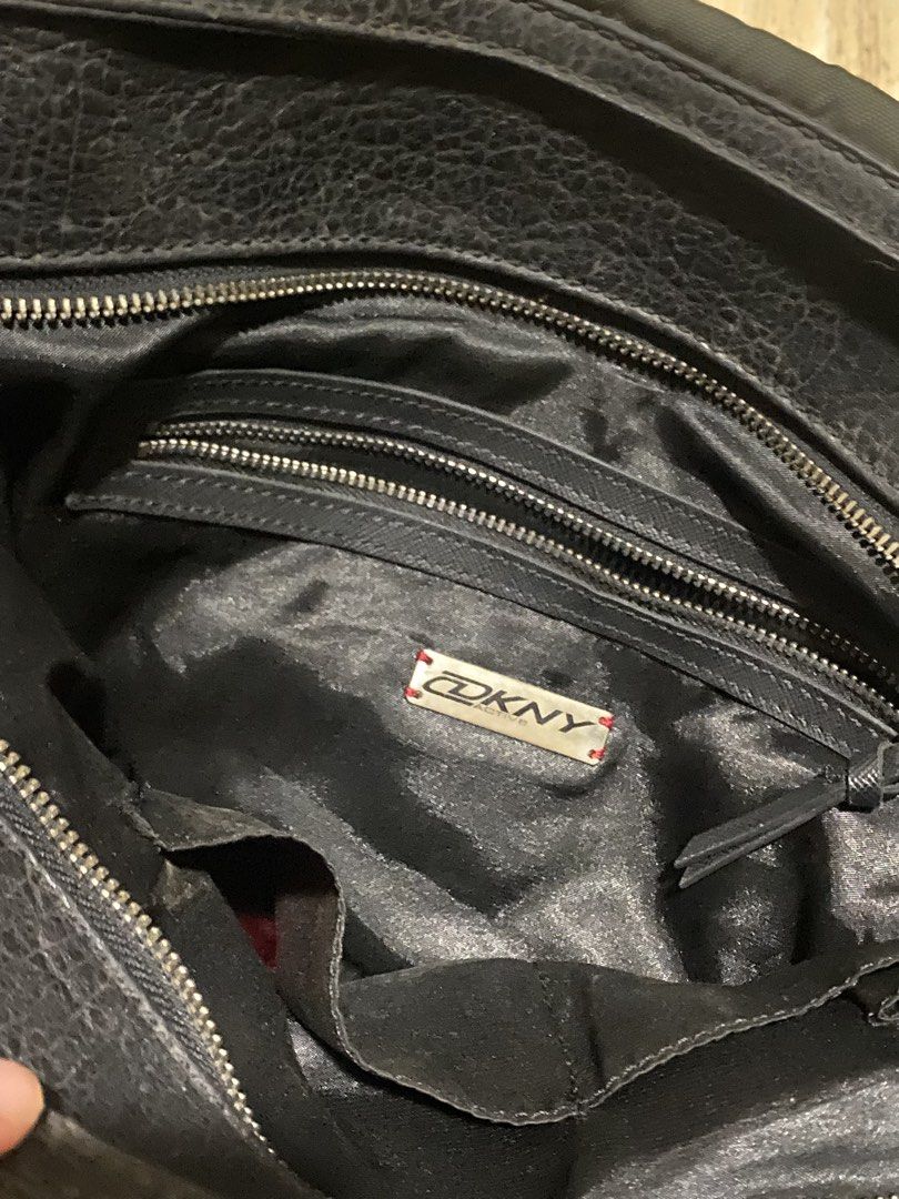 DKNY Sequin Logo Tote Bag (Category: Tote Bags) located in Navotas City. Submitted by sophiadnse (Listing ID 1460792508, Image 3). Description: - DKNY tote bag - Dark Gray with black trim - Eye-catching sequin logo - Spacious interior - Interior zip pockets for organization - Secure main zip closure - Includes a decorative charm on the strap - Ideal for everyday errands or travel adventures.