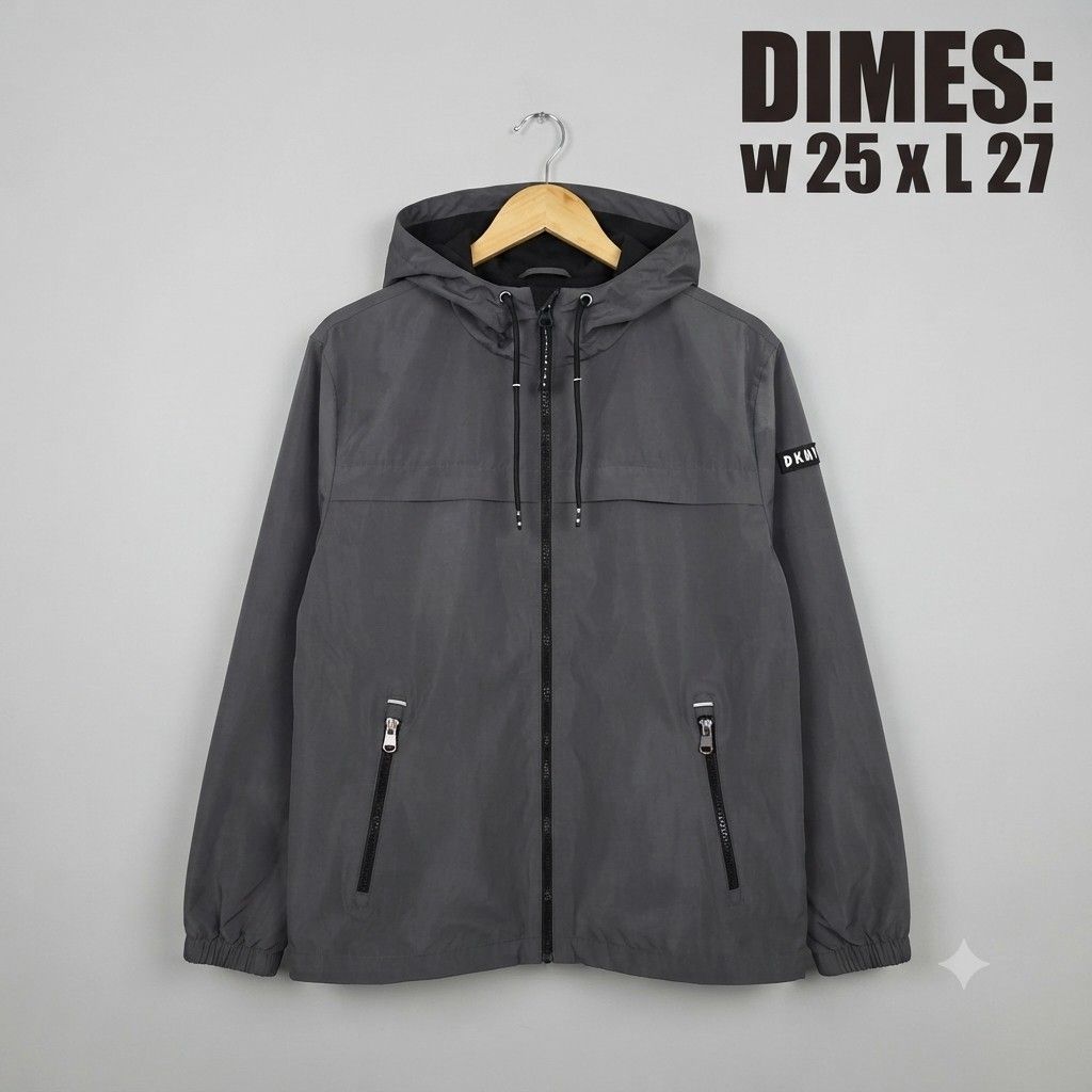 DKNY Sport Windbreaker Jacket Grey Size L (Category: Coats, Jackets and Outerwear) located in Manila. Submitted by nnthrift_ (Listing ID 1460892318, Image 1). Description: - Grey DKNY Sport windbreaker jacket - Size: Large (L) - Features a hood - Equipped with zip pockets - Adjustable drawstring at the hem - Ideal for casual wear or light outdoor activities.