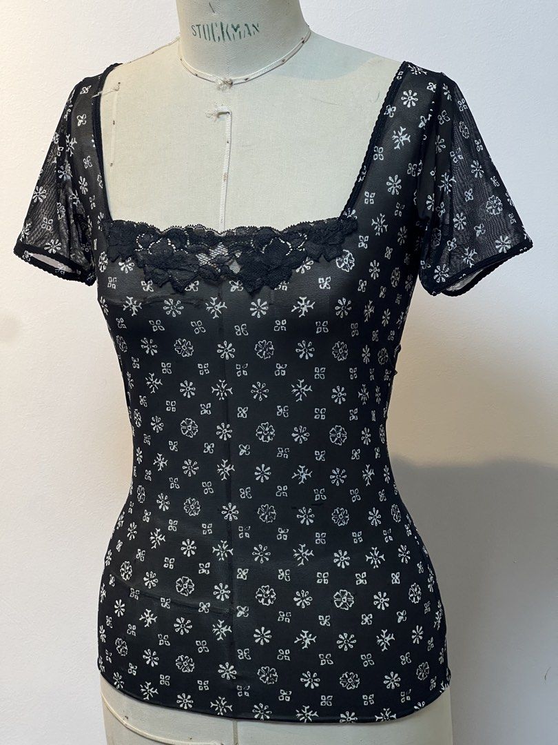 Dolce & Gabbana stretch top (Category: Luxury Apparel) located in Quezon City. Submitted by raccoonfur (Listing ID 1460802608, Image 1). Description: Dolce & Gabbana lace princess neckline stretch top. Very Lindsay Lohan. Great condition. Flat measurements:(unstretched) Armpit to armpit 42.5cm Waist 35cm Hips 43cm Shoulders 35cm Length 62cm Sleeve length 17cm.