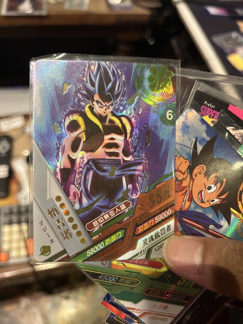Dragon Ball Super Card - Gogeta SSJ Blue (Category: Raw Singles) located in Iloilo. Submitted by jackpot.treasures (Listing ID 1460725521, Image 1). Description: - Dragon Ball Super Card featuring Gogeta in Super Saiyan Blue form. - Card text includes 'Gogeta' and 'Super Saiyan Blue'. - Impressive stats: Attack Power 59000, Defense 58000. - Comes with an additional Goku card. - Ideal for Dragon Ball Z and Super collectors!.