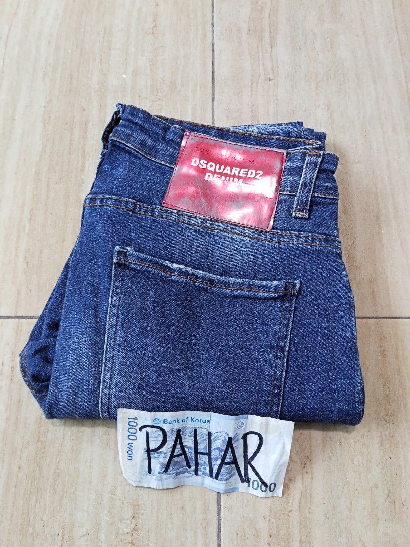DSQUARED2 Denim Jeans (Category: Jeans) located in Glan. Submitted by cpaharodde48008 (Listing ID 1460749203, Image 1). Description: - Authentic DSQUARED2 denim jeans - Dark wash with distressed details and fading - Button fly closure - Classic five-pocket styling - Size: 40 - Ideal for everyday wear.