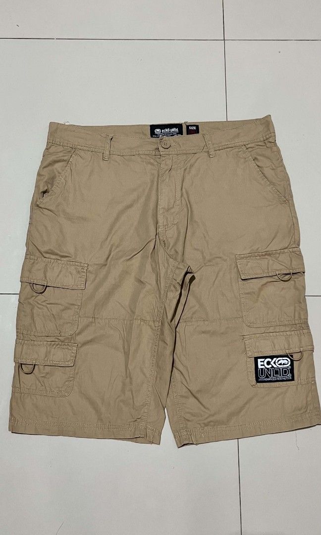 Ecko Unltd. Cargo Shorts Size 36 Tan (Category: Shorts) located in Manila. Submitted by sandobag (Listing ID 1457056503, Image 1). Description: - Cargo Shorts - W 36-38 L 25 - Excellent Condition - Color rate: 10/10 - Brand: Ecko Unltd. - Color: Tan - Size: 36 - Style: Classic Cargo Shorts - Features: Multiple pockets for ample storage - Closure: Button and zip fly - Ideal for: Casual wear, outdoor activities.