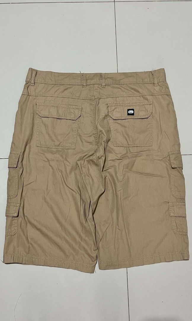 Ecko Unltd. Cargo Shorts Size 36 Tan (Category: Shorts) located in Manila. Submitted by sandobag (Listing ID 1457056503, Image 2). Description: - Cargo Shorts - W 36-38 L 25 - Excellent Condition - Color rate: 10/10 - Brand: Ecko Unltd. - Color: Tan - Size: 36 - Style: Classic Cargo Shorts - Features: Multiple pockets for ample storage - Closure: Button and zip fly - Ideal for: Casual wear, outdoor activities.