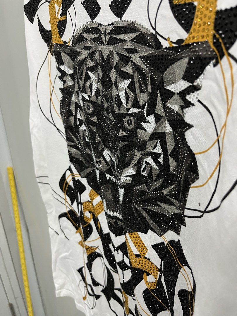 Ed Hardy Tiger Graphic Tee (Category: Tshirts & Polo Shirts ) located in Valencia. Submitted by shopstnd (Listing ID 1460830171, Image 3). Description: Ed Hardy Tiger Graphic Tee Size: XS 📏 21 × 30 in ⭐ Condition: 9/10 🎨 Color: 9/10 🐯 Large rhinestone tiger graphic Minimal signs of wear may be present; actual color may slightly vary due to lighting..
