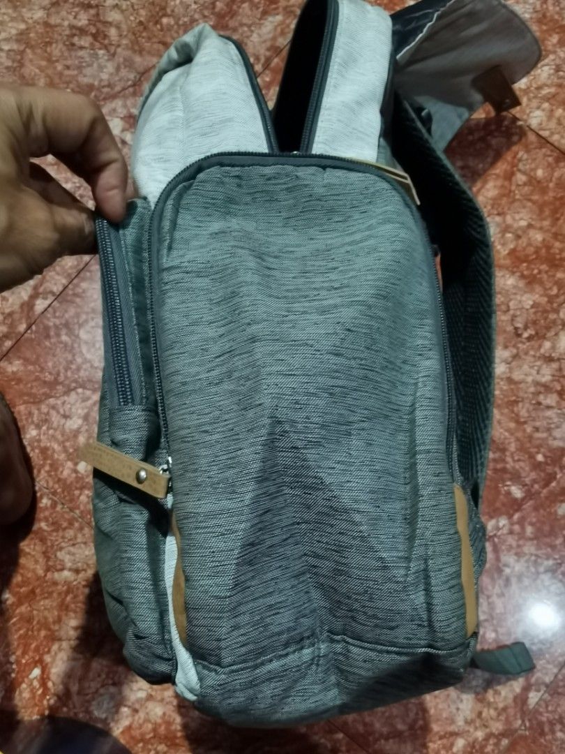 Eddie Bauer First Adventure Backpack (Category: Backpacks) located in Caloocan City. Submitted by cooldudeszion (Listing ID 1460886280, Image 3). Description: - Eddie Bauer backpack in grey and light grey. - Multiple compartments inside, including a zippered pocket. - Insulated front pocket for keeping items cool. - Ideal for day trips, school, or everyday use. - Minor signs of wear on the exterior. Adventure Bag Large capacity More compartment g