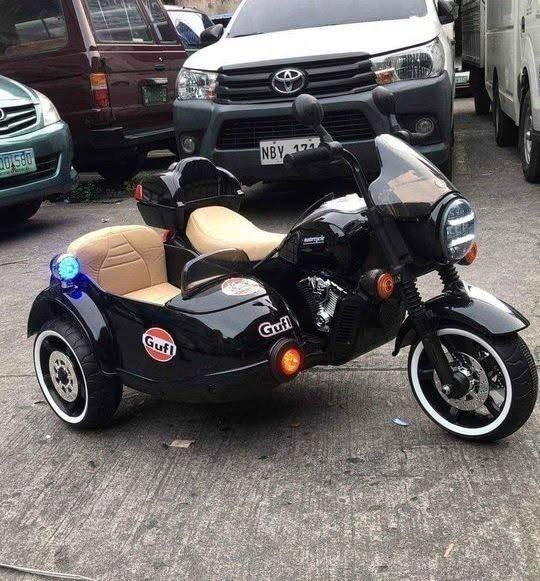 Electric Sidecar Motorcycle Ride-on for kids (code 1916) (Category: Kids Toys) located in Pasay City. Submitted by joyful_mayette (Listing ID 1460780714, Image 3). Description: Electric Sidecar Motorcycle Ride-on for kids (code 1916) Price: 10,000 PHP Colors available: Black and Red 🔵 Brand new 🔵 Product size: 125x80x80cm 🔵 Suitable for ages 1-8 years old 🔵 Maximum weight capacity: 70 kg 🔵 Rubber tires/Leather seat 🔵 Battery:12v7A 🔵 With M