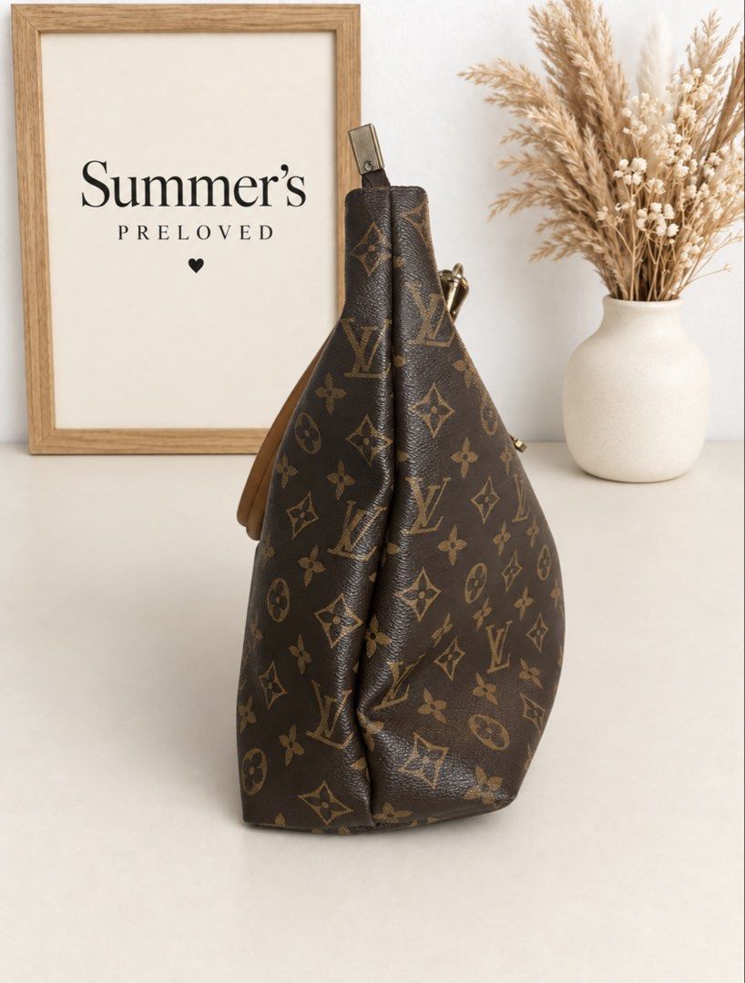 Elvira Monogram Pallas tote (Category: Tote Bags) located in Taguig. Submitted by summers.preloved (Listing ID 1460892589, Image 2). Description: BAG DETAILS 👜 Model: Pallas Tote 🤎 Color: Classic Brown Monogram with Tan Trim ✨ Hardware: Gold-tone metal with chain-link handle attachments 🔒 Closure: Full top-zip closure 👝 Exterior: Rear zip pocket 🧳 Interior: Spacious main compartment with multiple organizer pockets and an interior zip pocket 