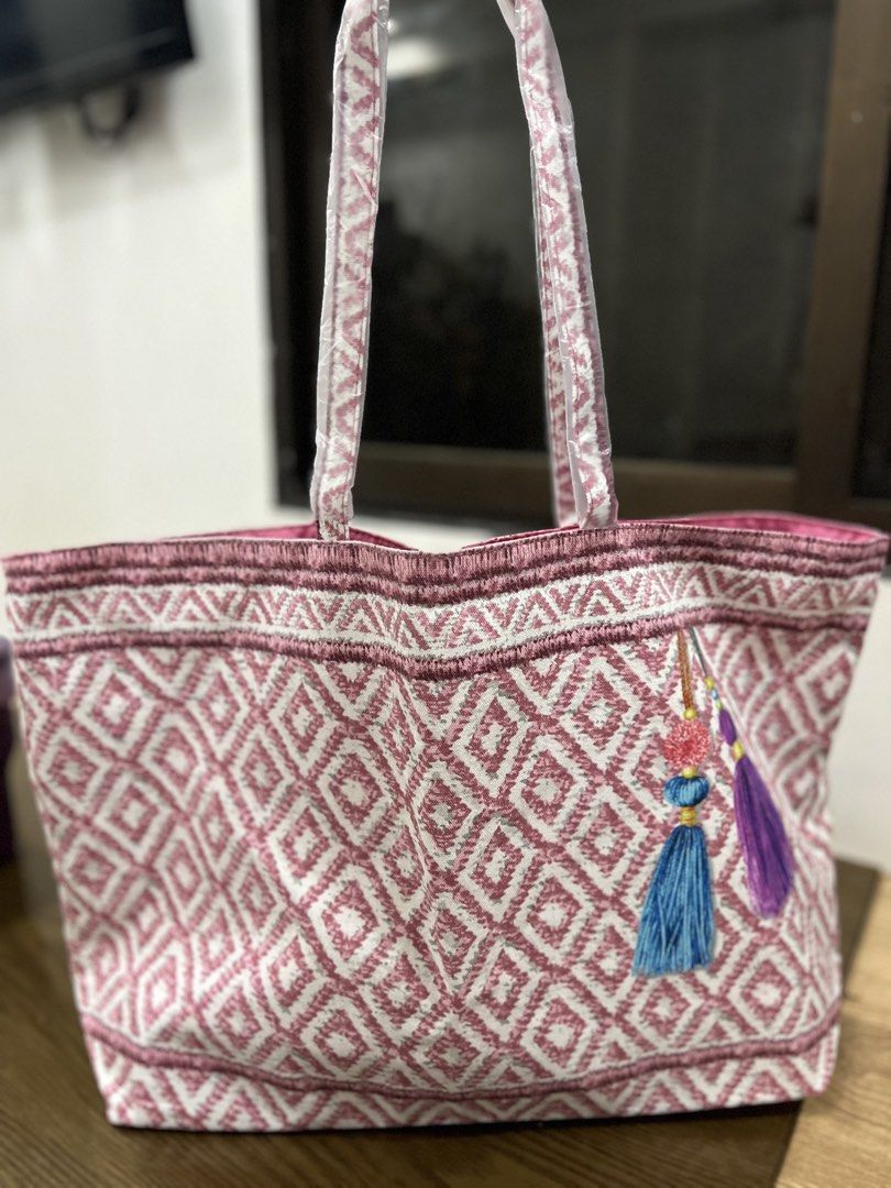 Embroidered Tote Bag with Tassels (Category: Tote Bags) located in Quezon City. Submitted by happyshop31 (Listing ID 1460726878, Image 1). Description: - Cute embroidered tote bag - Pink and white diamond pattern - Colorful tassels on the side - Ideal for beach days or everyday use - Plenty of interior space - Sturdy handles - Ready for a new owner.