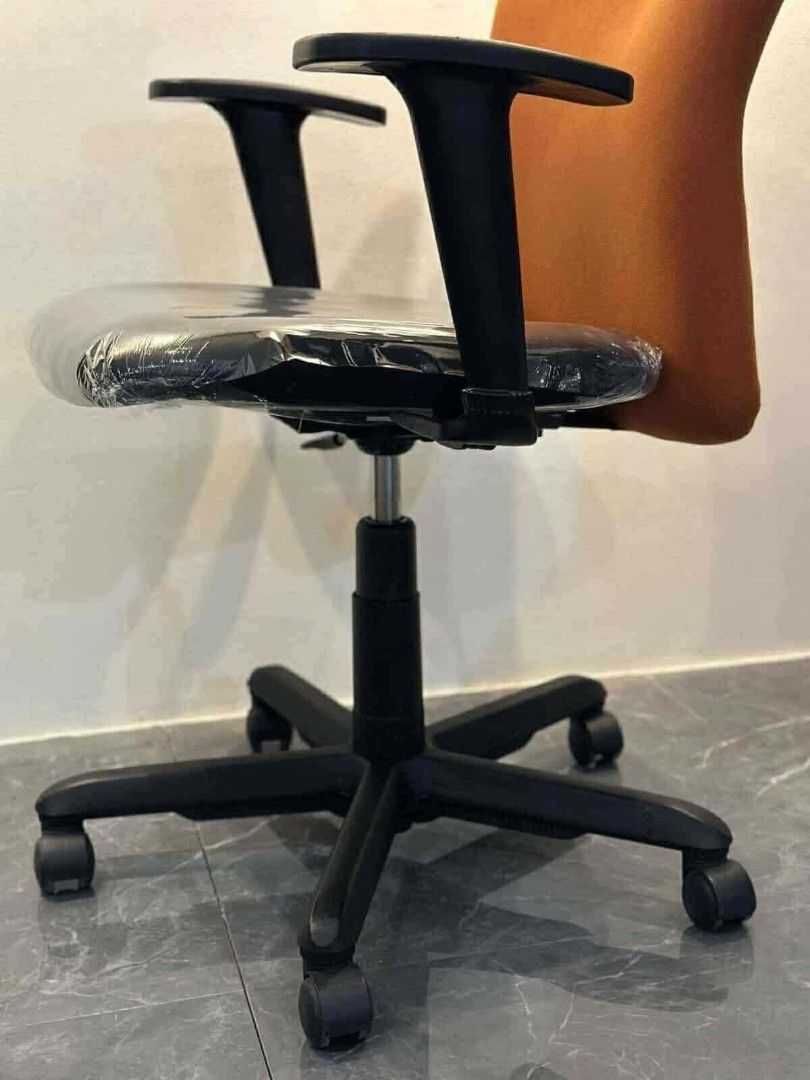 Ergonomic Office Chair with Orange Backrest (Category: Chairs) located in Manila. Submitted by Persephone13 (Listing ID 1460765139, Image 3). Description: Orange fabric office chair with adjustable height and armrests. Seat still has protective plastic. Rolls smoothly. Perfect for your office or home..