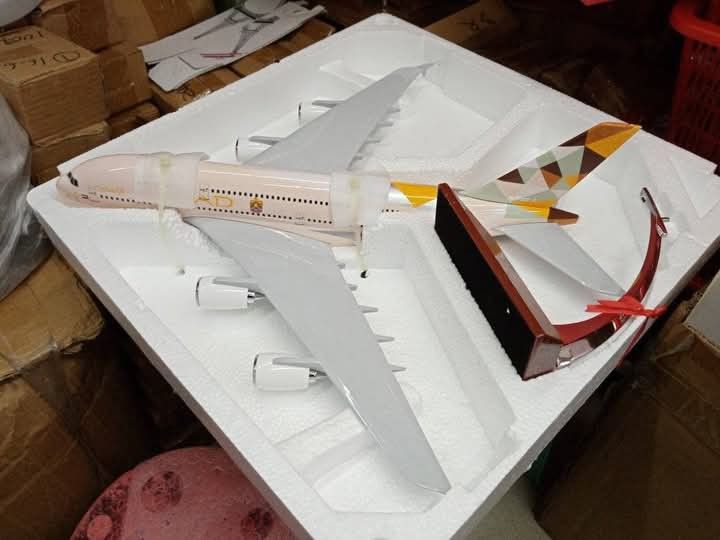 Etihad Airways A380 Airplane Model with Stand (Category: Vehicle & Diecast Models) located in Manila. Submitted by iliasjen3082126 (Listing ID 1460786621, Image 1). Description: - Model airplane: Etihad Airways A380 - Includes display stand - Distinctive geometric pattern on the tail - White fuselage with authentic Etihad livery - Ideal for collectors and aviation enthusiasts.