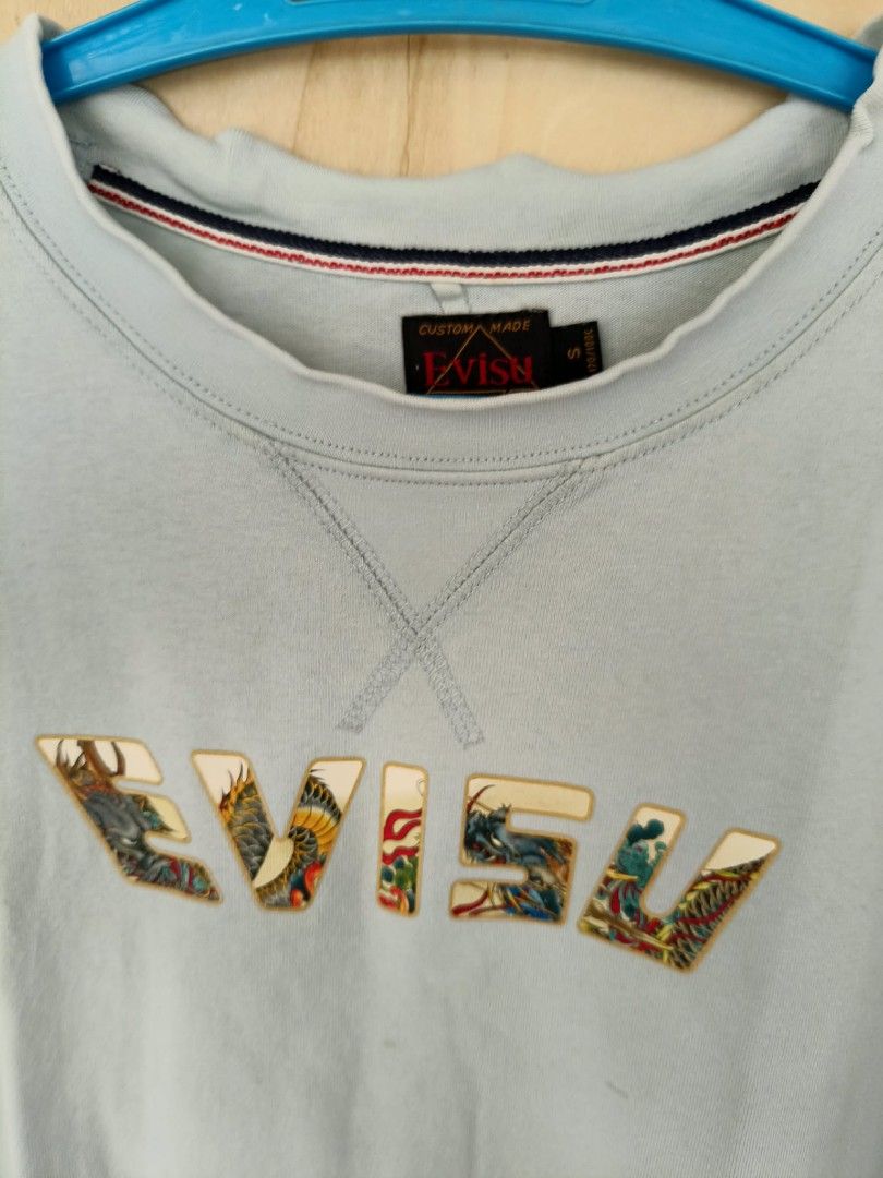 Evisu Tee (Category: Tshirts & Polo Shirts ) located in La Carlota. Submitted by leamart25 (Listing ID 1460826360, Image 3). Description: Dimes: W19 x L24 Issue: bacon neckline Color rate: 9/10.