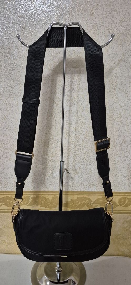 F13-499 Elle Black Chic Nylon Sling Bag (Category: Cross-body Bags) located in Valenzuela. Submitted by dailyhappyfinds (Listing ID 1460787963, Image 2). Description: BRAND: Elle -Brand new without tag -Shoulder bag and sling bag -Light scratches on metal part -Please check last photo for details *Mall pullout/ factory pullout, please manage your expectations.