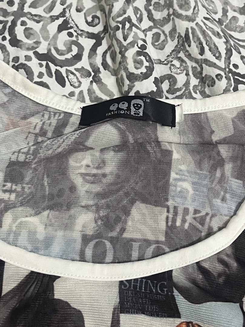 Fashion Graphic Print Mesh Top (Category: Others Tops) located in Aringay. Submitted by loaf_thrifts (Listing ID 1460860414, Image 3). Description: - Graphic print mesh top with sheer sleeves - Rhinestone and bold text details on top - Dark wash denim shorts with cuffed hem - Studded details on shorts - Ideal for casual outings or night events - Unique and eye-catching style.