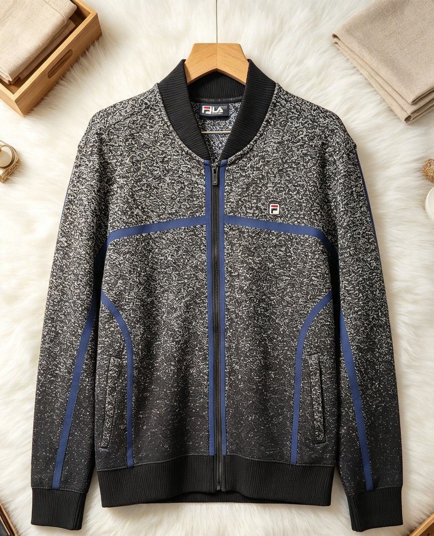 Fila Bomber Jacket (Category: Coats, Jackets and Outerwear) located in Manila. Submitted by momofunodos (Listing ID 1460834388, Image 1). Description: - Fila bomber jacket - Speckled grey and black pattern - Blue stripe accents on front and sleeves - Ribbed collar, cuffs, and hem - Zipper closure - Two side pockets Note! buy at your own risk this is ukay kau n mg legit ✅.