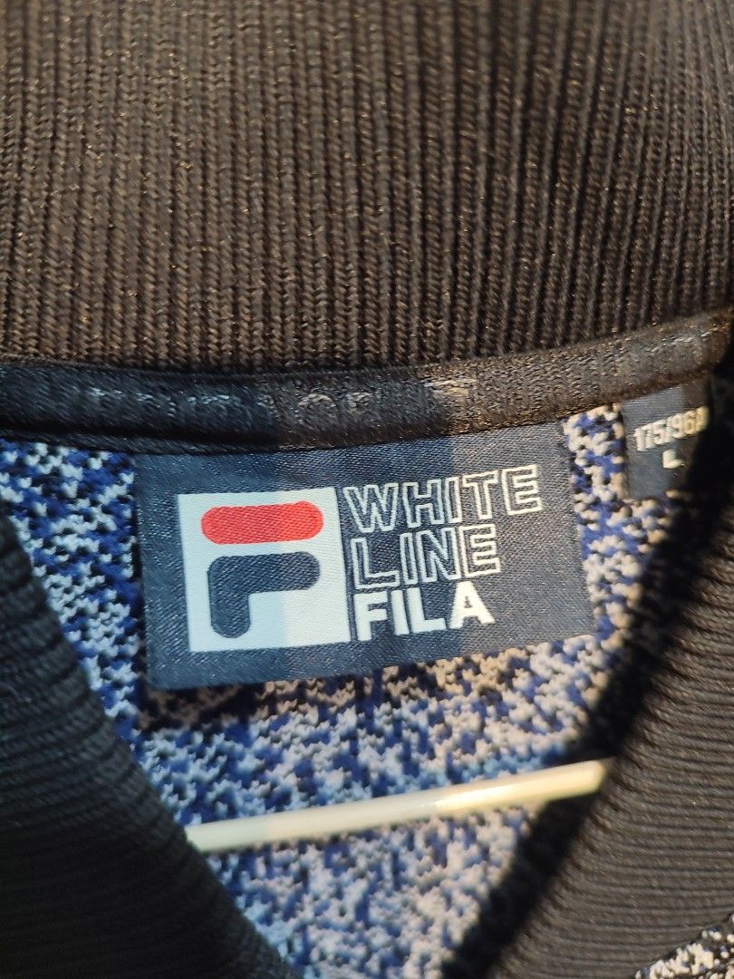 Fila Bomber Jacket (Category: Coats, Jackets and Outerwear) located in Manila. Submitted by momofunodos (Listing ID 1460834388, Image 2). Description: - Fila bomber jacket - Speckled grey and black pattern - Blue stripe accents on front and sleeves - Ribbed collar, cuffs, and hem - Zipper closure - Two side pockets Note! buy at your own risk this is ukay kau n mg legit ✅.