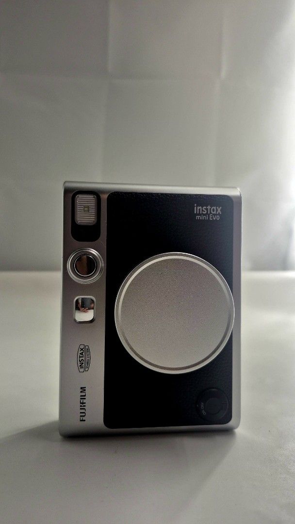 Fujifilm Instax Mini Evo Hybrid Instant Camera (Category: Cameras) located in Manila. Submitted by jeremiaha38234 (Listing ID 1460741328, Image 2). Description: FS: INSTAX MINI EVO BLACK ⭐️PHP 10K (BOUGHT IT FOR 12K SLIGHT NEGO IF GET TODAY) ⭐️Purchased last March 2026 ⭐️Used occassionally (di lalagpas sa 10 daliri) ⭐️In good condition INCLUSIONS: 🔆Original Box 🔆USB Charging Cable 🔆Transparent Case 🔆Brand New Lens Cap 🔆Original Strap LOC: NO
