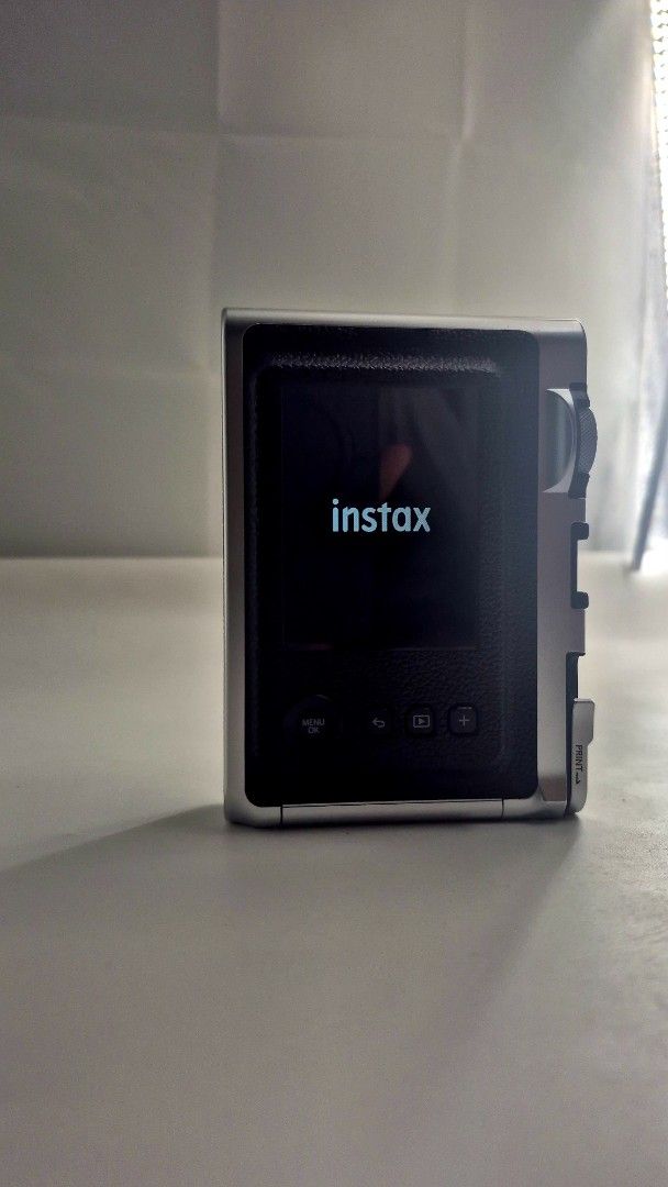 Fujifilm Instax Mini Evo Hybrid Instant Camera (Category: Cameras) located in Manila. Submitted by jeremiaha38234 (Listing ID 1460741328, Image 3). Description: FS: INSTAX MINI EVO BLACK ⭐️PHP 10K (BOUGHT IT FOR 12K SLIGHT NEGO IF GET TODAY) ⭐️Purchased last March 2026 ⭐️Used occassionally (di lalagpas sa 10 daliri) ⭐️In good condition INCLUSIONS: 🔆Original Box 🔆USB Charging Cable 🔆Transparent Case 🔆Brand New Lens Cap 🔆Original Strap LOC: NO