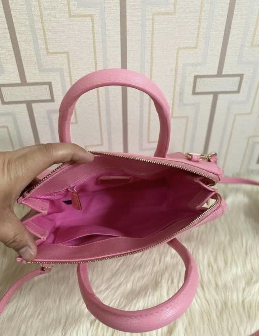 Furla Pink Leather Top Handle Bag with Strap (Category: Luxury Bags & Wallets) located in Marilao. Submitted by vhi3yhn (Listing ID 1460766326, Image 2). Description: - Original Pink Furla Handbag - Textured Leather Material - Versatile: Top Handles & Detachable Shoulder Strap - Secure Zip Closure - Organized Interior: Zip Pocket & Slip Pockets - Elegant Gold Hardware - Comes with Authenticity Card.