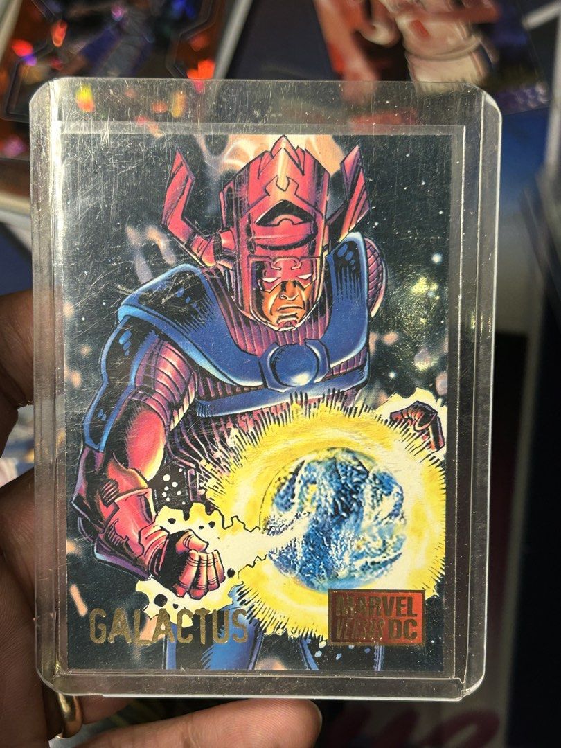 Galactus (DC vs Marvel) (Category: Raw Singles) located in Iloilo. Submitted by jackpot.treasures (Listing ID 1460718569, Image 1). Description: - Galactus trading card from Marvel Vs DC - Card is in a protective sleeve - Features Galactus holding a planet - Ideal for collectors.