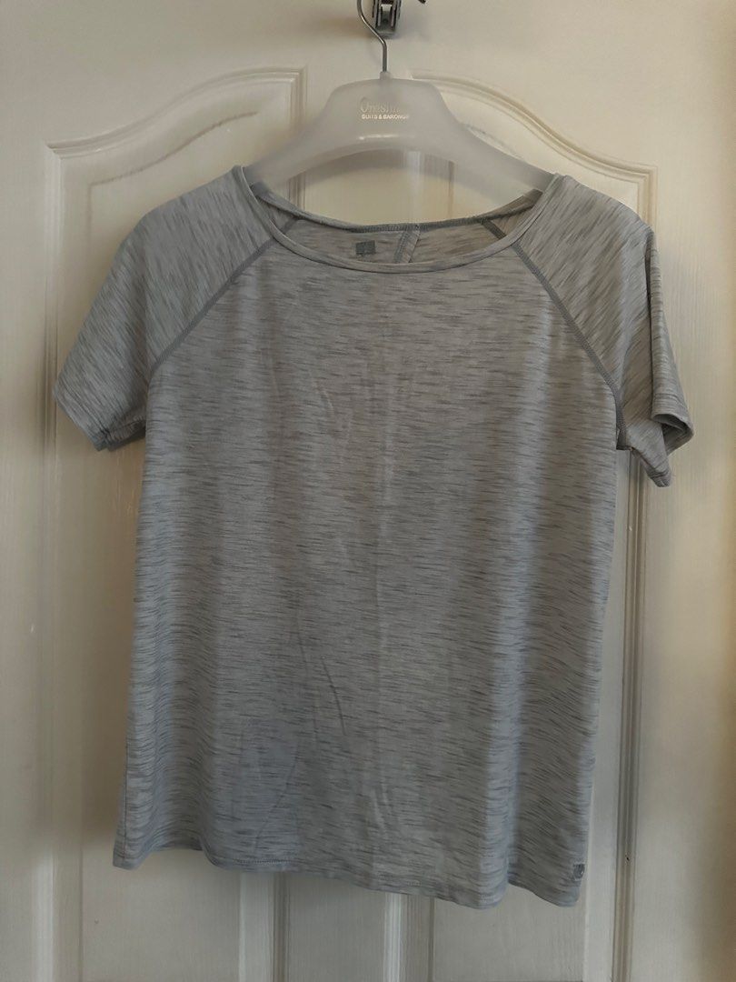 GAP Grey Marled Twist Back T-shirt Open Back (Category: Shirts) located in Manila. Submitted by nfcloset_ (Listing ID 1460793609, Image 2). Description: - Light grey marled t-shirt - Short sleeves with raglan seams - Open back with a chic twist knot detail at the hem - Made from comfortable and breathable fabric - Versatile for workouts or casual outfits.