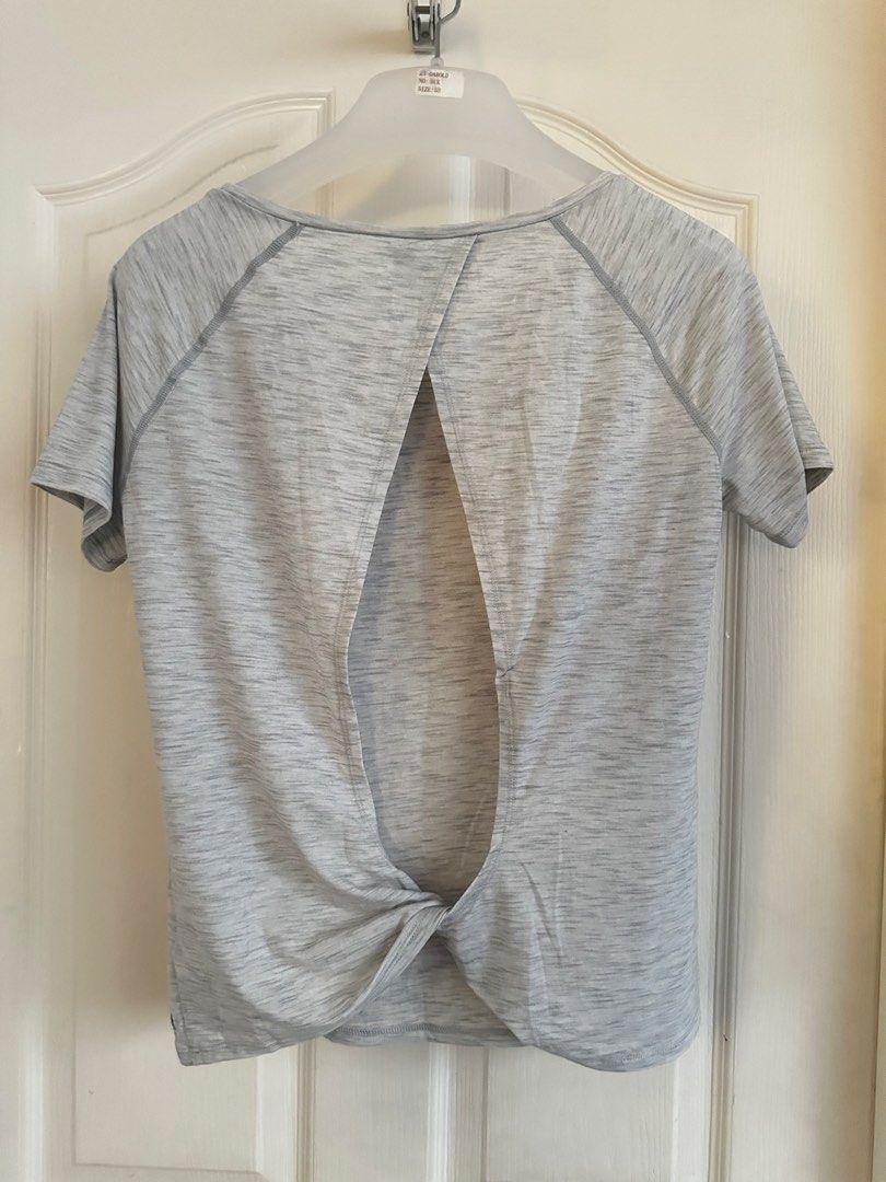 GAP Grey Marled Twist Back T-shirt Open Back (Category: Shirts) located in Manila. Submitted by nfcloset_ (Listing ID 1460793609, Image 1). Description: - Light grey marled t-shirt - Short sleeves with raglan seams - Open back with a chic twist knot detail at the hem - Made from comfortable and breathable fabric - Versatile for workouts or casual outfits.